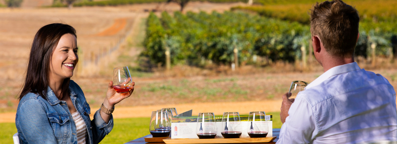 Couple enjoying Pindarie wines outside 